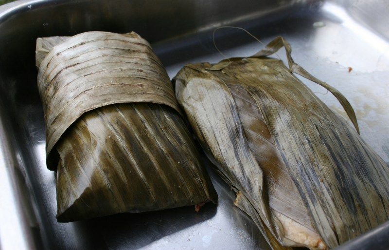 A Mexican dish (help me out if you know, but I think tortillas) was wrapped in banana leaves. My husband and I tried this.
