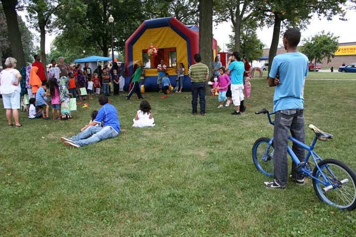Fest, boy on bike watching