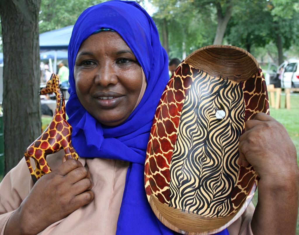 Lul Abdi shows off beautiful wood crafts from Kenya and Somalia.