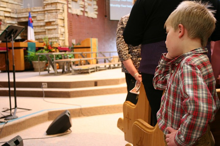 Concert, boy in pew