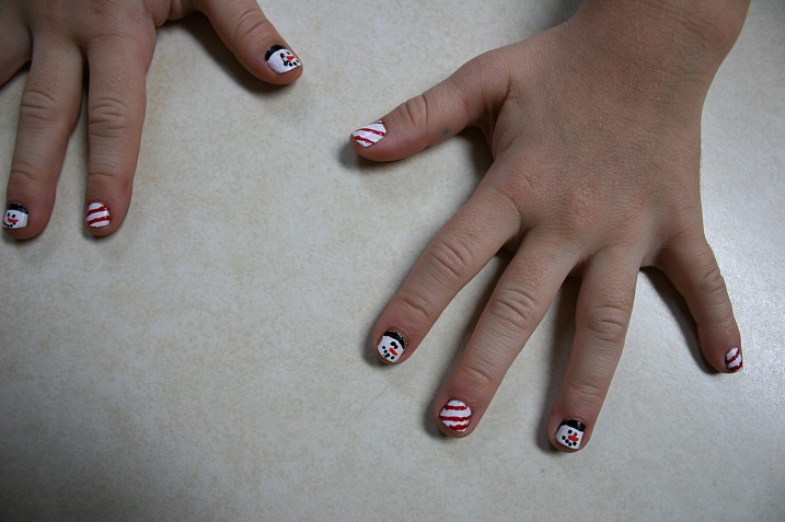 Nevaeh's cute, cute holiday painted fingernails.