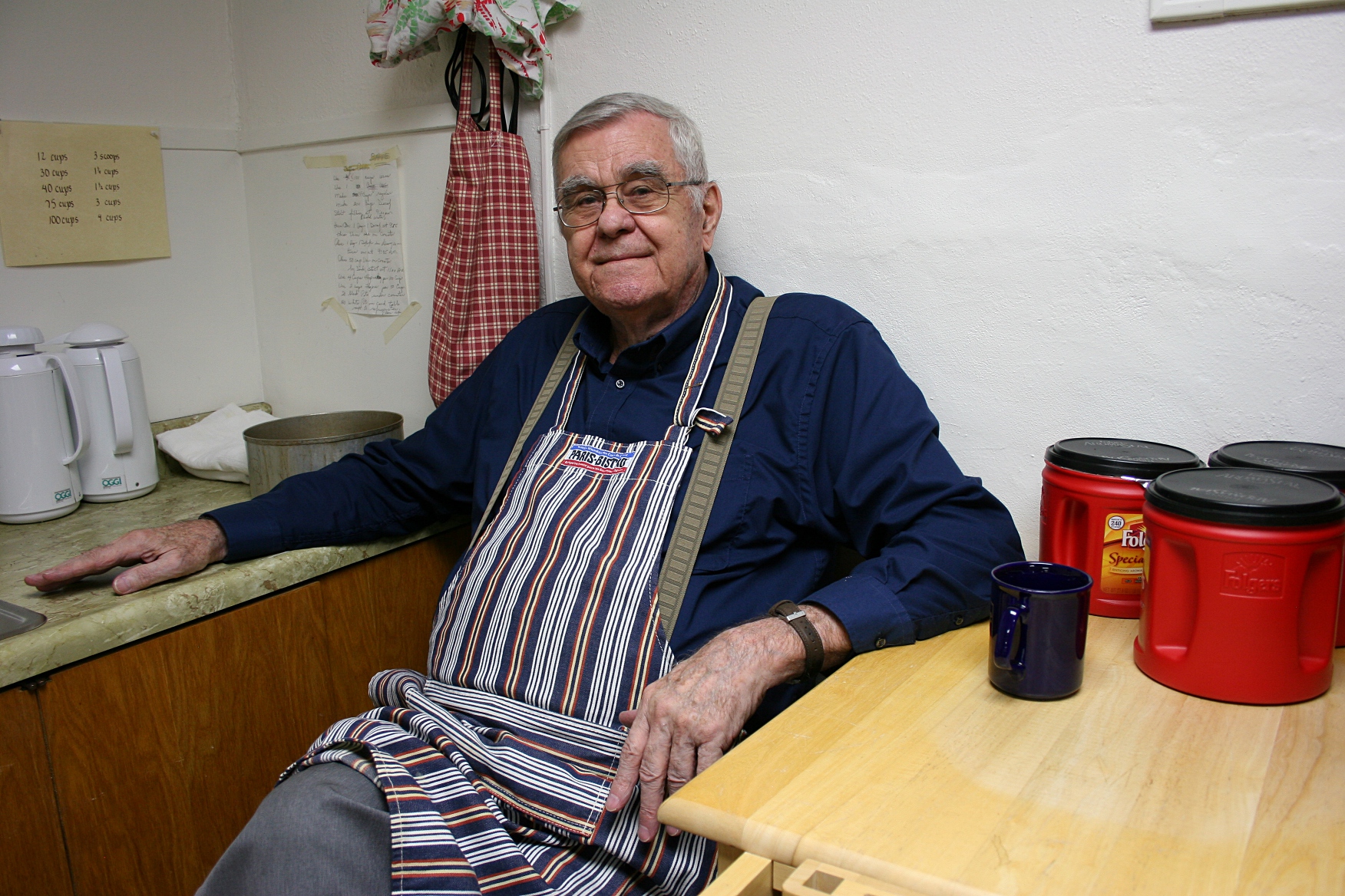Coffee maker Dan Tersteeg mans the coffee corner. The coffee makers always use Folgers coffee, he says, because it works best with Faribault's water.