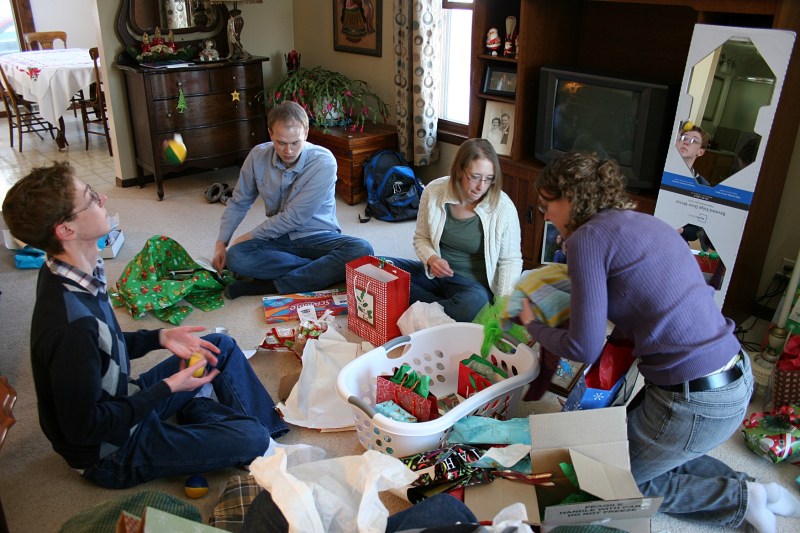 My three, plus the eldest daughter's boyfriend, Marc, opened gifts Christmas Eve afternoon. Caleb is juggling on the left with his new juggling balls.