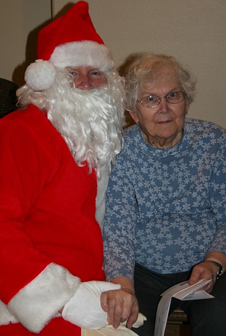 Santa always poses for a photo with my mom.