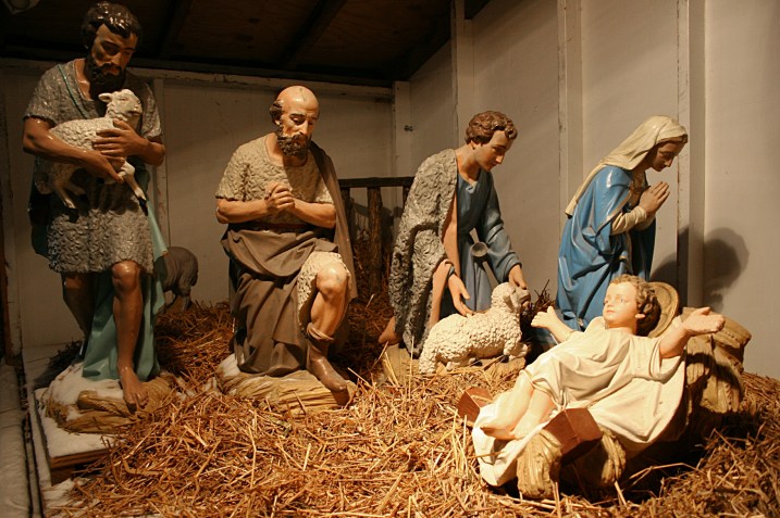 One side of the scene shows the shepherds in the stable.