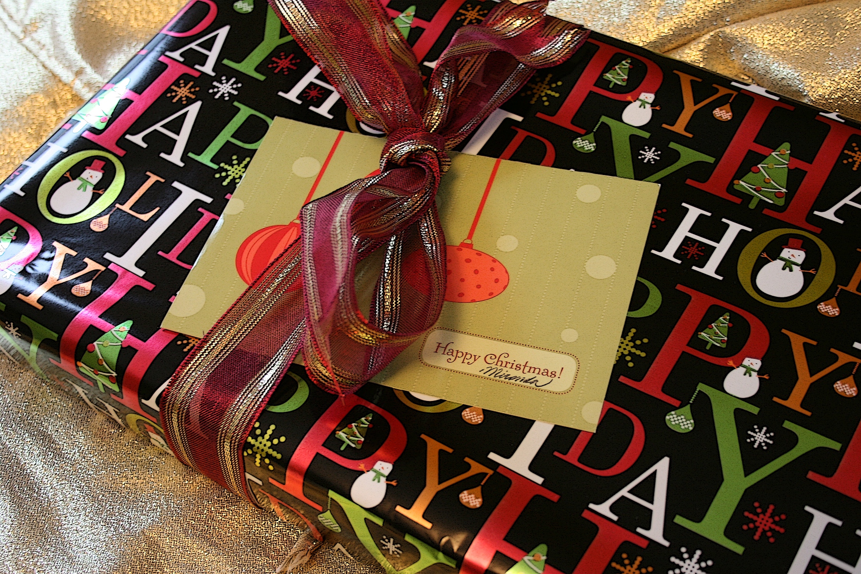 A recycled ribbon and card grace this package.