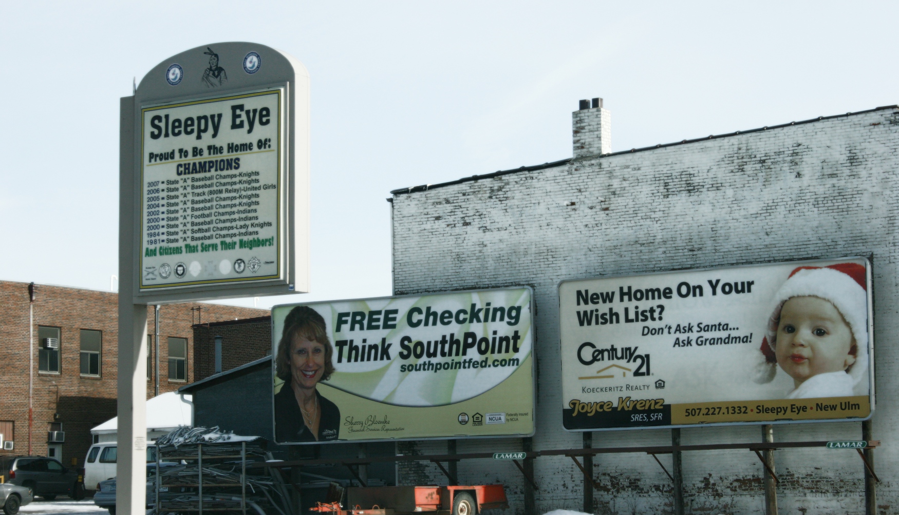 This creative real estate billboard in Sleepy Eye, at the intersections of U.S. Highway 14 and Minnesota Highway 4, makes me smile. A nearby sign boasts the local high school's athletic accomplishments.