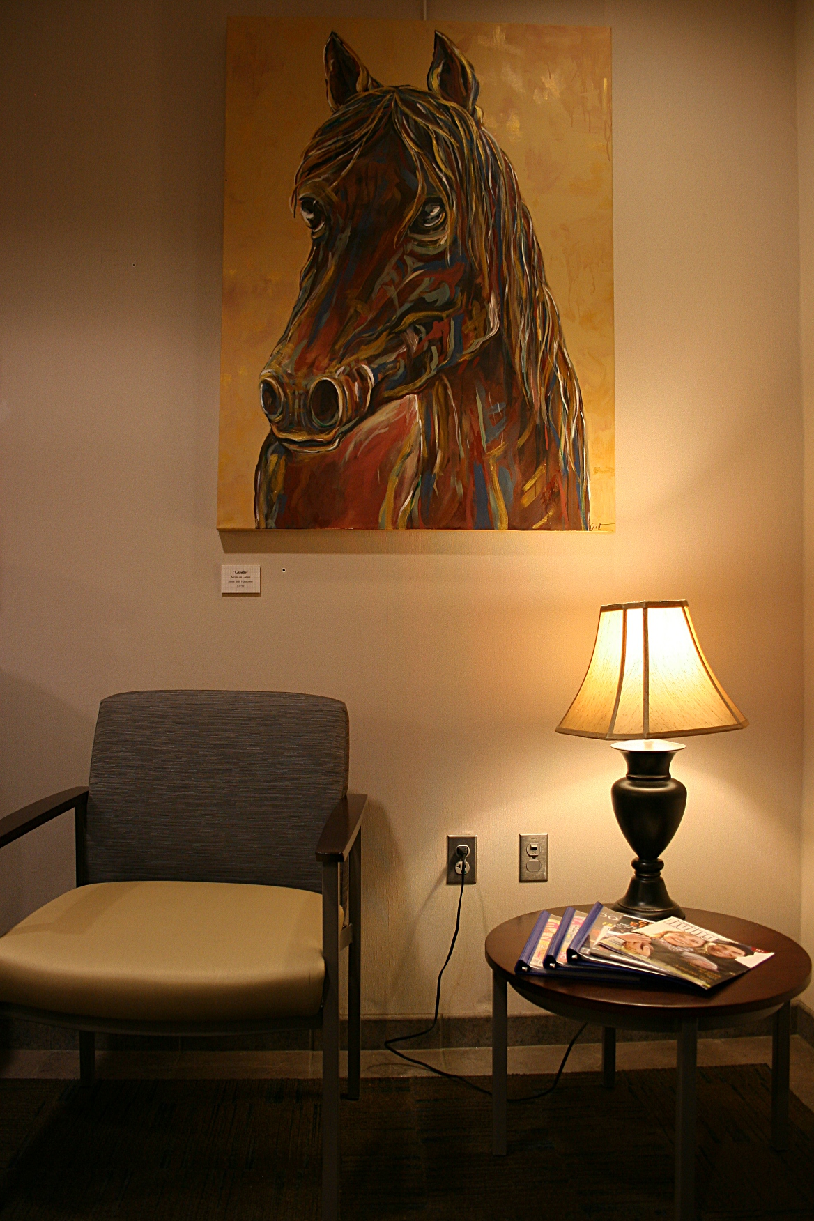 Tucked into a corner by the elevators, the fourth of Hanscom's horse oil paintings.
