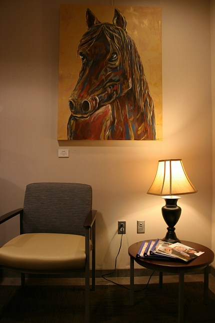 Tucked into a corner by the elevators, the fourth of Hanscom's horse oil paintings.