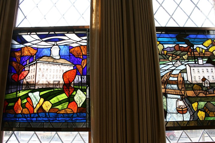 Windows in the Siekman Room depict the history of the Fox Cities from the days of the early explorers until modern times.