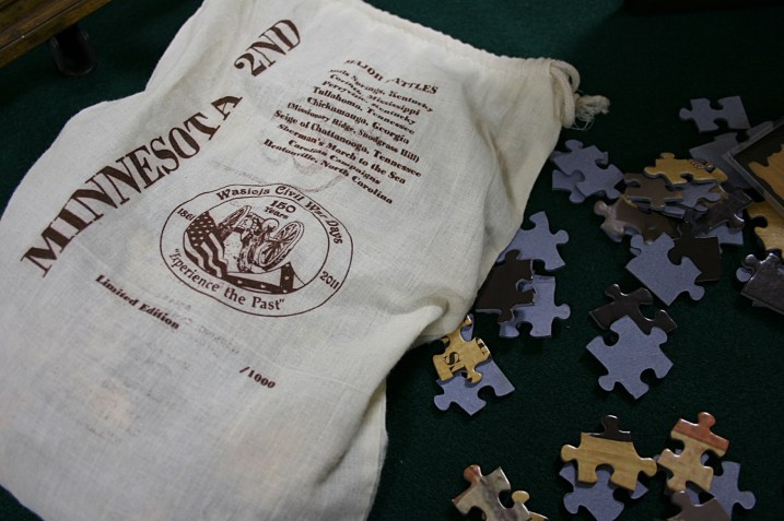 This cloth bag holds the puzzle pieces and informational sheets.