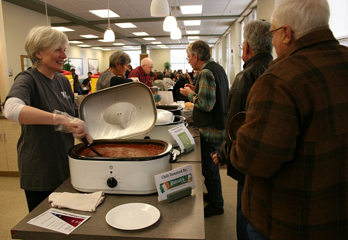 Diners line up for soup or chili. Seconds could be had for a freewill donation.
