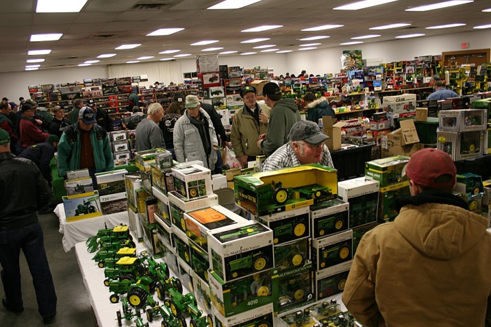Masses of shoppers among a mass of merchandise.