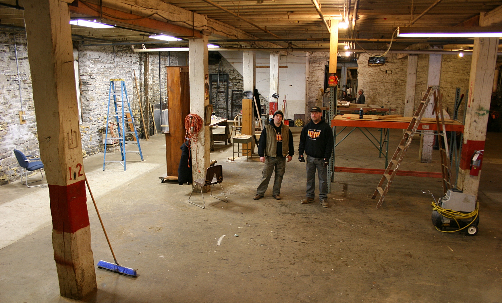 Chris Voegele, left, and Noah Strouth inside the space that will house Patriot's Brewing brewery.