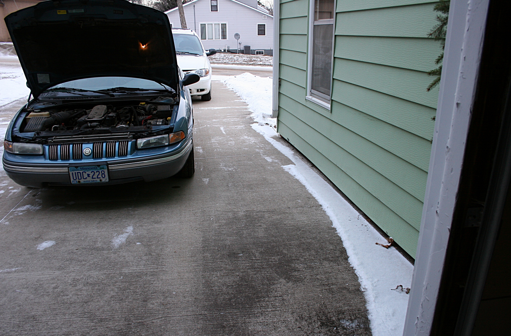 The Chrysler Concorde, photographed several hours after we pushed it from the garage.