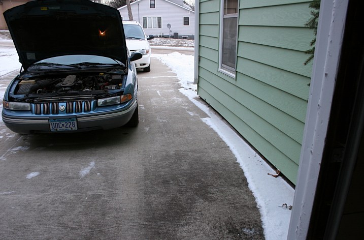 The Chrysler Concorde, photographed several hours after we pushed it from the garage.