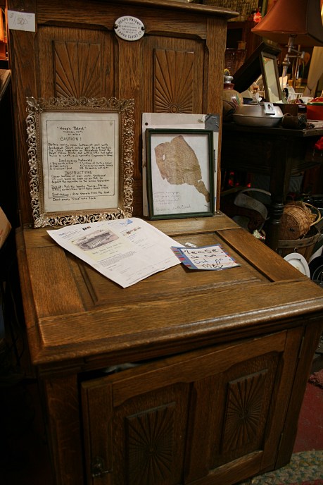 Not just a fine piece of furniture, but a toilet. The door opens to reveal a urine receptacle on the inside of a door and a pail tucked underneath.