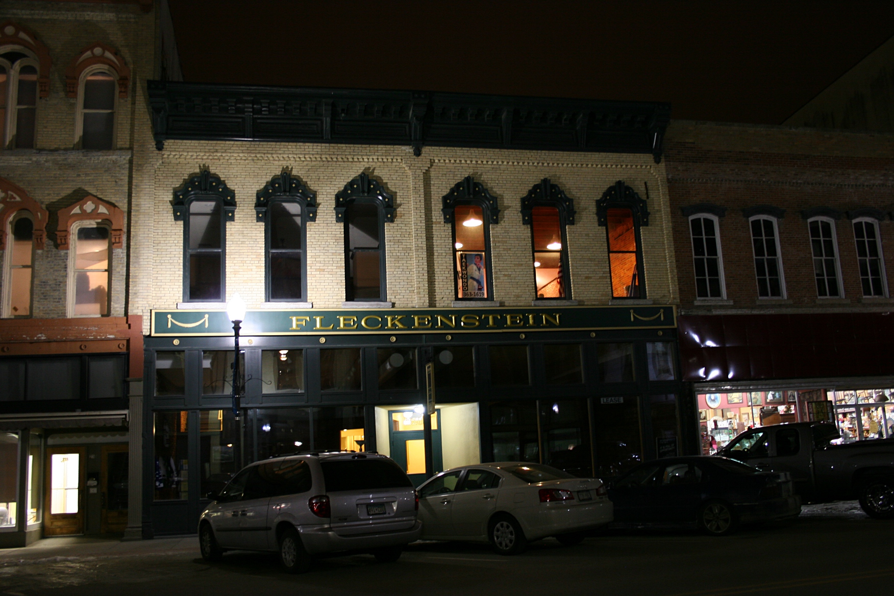 The Fleckenstein building houses Twin City Underwriters in the south front with empty space for lease in the other half.