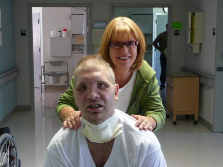 Garrett with his mom, Joyce Resoft, about a month after the bridge collapse.