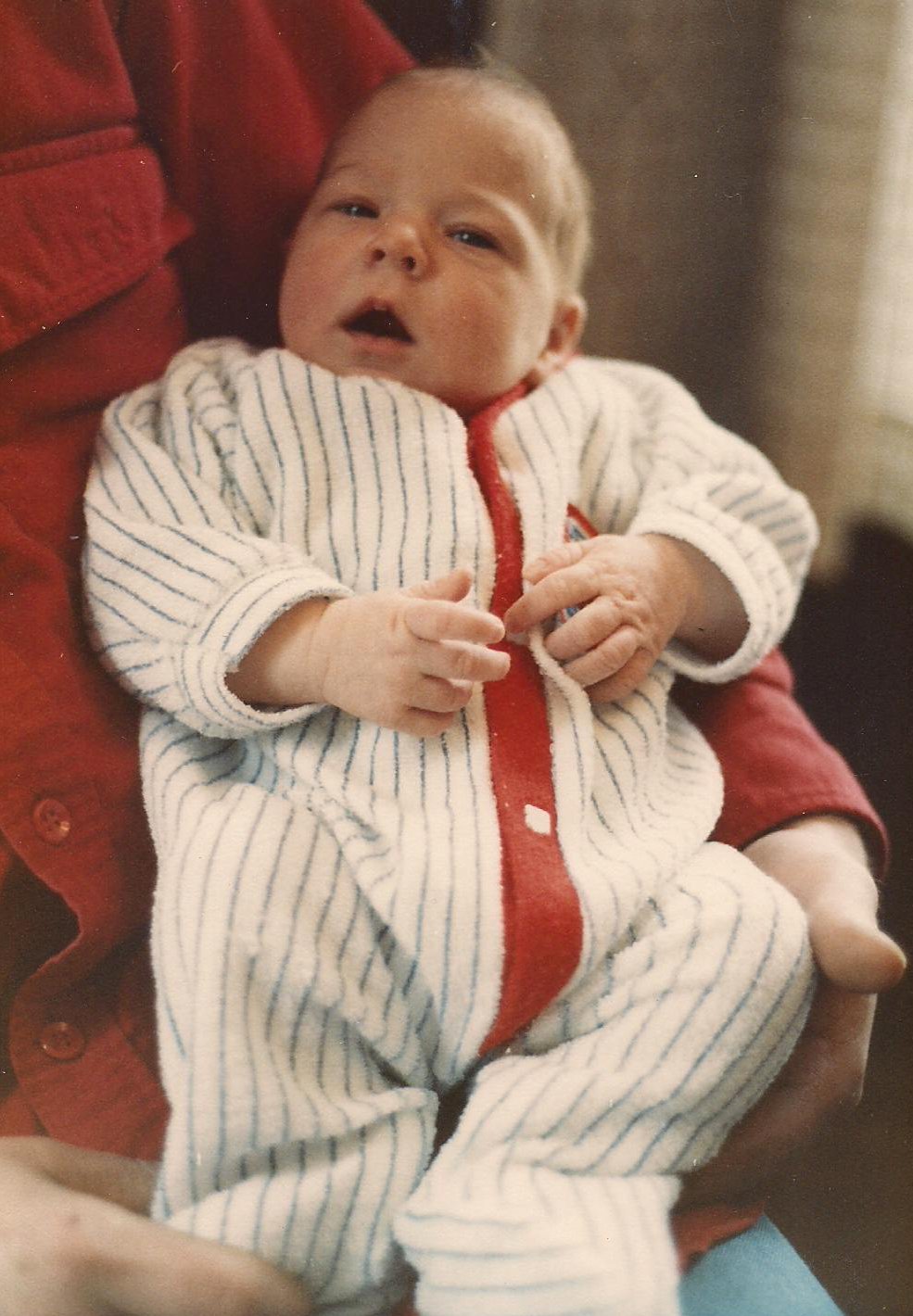 My oldest daughter at 12 days old. Already then she was a Minnesota Twins fan, in this hand-me-down sleeper.