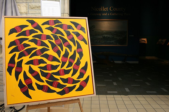 This artwork by Gordon M. Coons, which was on recent temporary display at the Traverse des Sioux Treaty Center, marks the 150th anniversary of the U.S.-Dakota War of 1862. According to information posted with the piece, "...the crows, known as messengers, are silent and unable to carry the stories of the 38 Dakota hanged in Mankato. Each crow carries the name of a Dakota hanged in Mankato. The texture on the crows is a blend of acrylic paint and soil from the historical sites of the Sioux Uprising of 1862. The soil is from the Traverse des Sioux treaty site of 1851 and eight other locations of the Sioux Uprising of 1862."