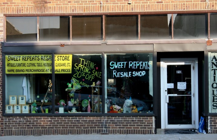 In the lower left corne you can see veterans' tributes in the window of Sweet Repeats Resale Shop.