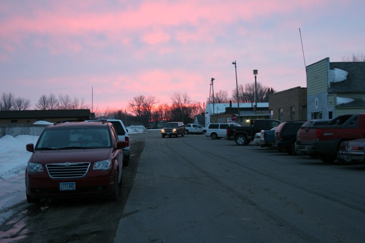 Standing in front of the community hall, I watch the sun set in my hometown.