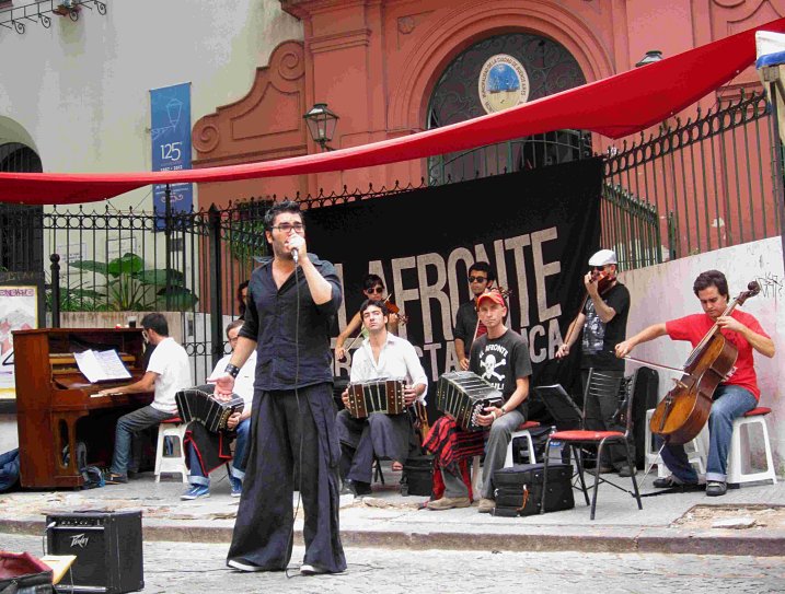 A tango band performs on the street during a fair in San Telmo barrio of Buenos Aires.