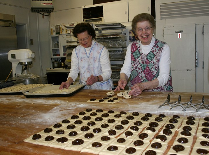 Mary Ann Kaisersatt, left, and Jule Franke make prune-filled kolacky.