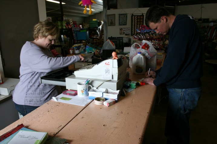 Jason Kramer stops in to buy a few grocery items from Bernadette.