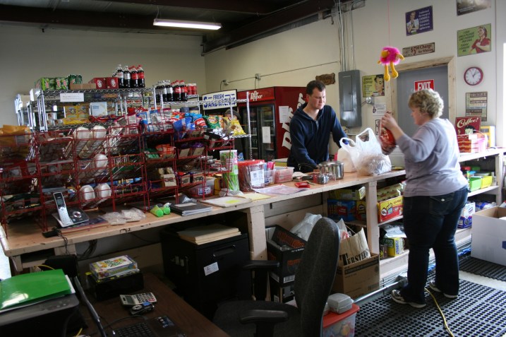 Just another view of the store with Bernadette bagging Jason's purchases.