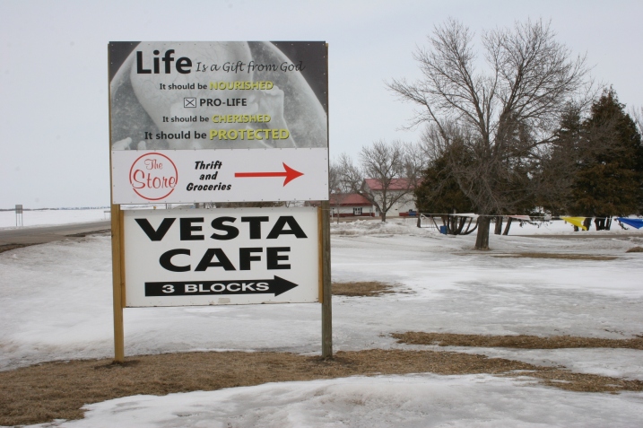 This sign by the thrift store points travelers along Minnesota Highway 19, left, to The Store and the Vesta Cafe.