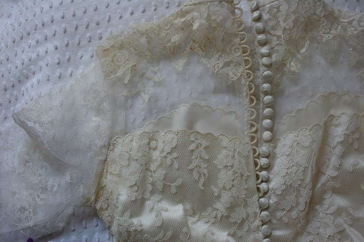 Just like the back of my aunt's dress, my mom's bridal gown closes with a long row of buttons.