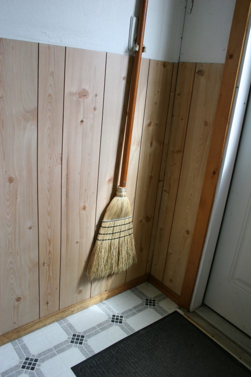 Propped inside the entry.