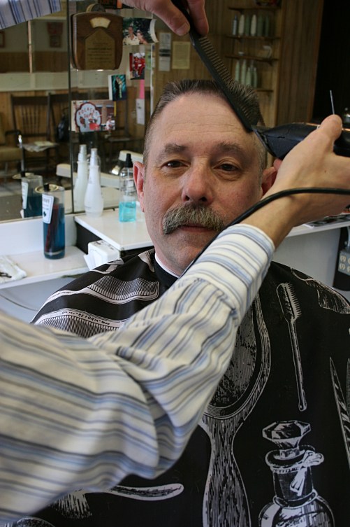 Steve gives Bill a flattop.