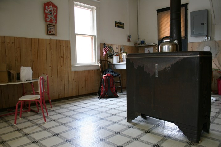 This free standing stove heats the small barbershop.