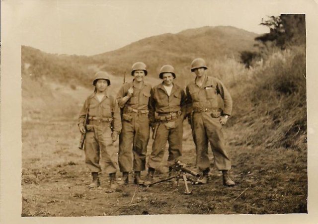 This photo from my dad's collection is tagged as "Kim, Rowe, Allen & me, May 1953 Machine Gun Crew." That's my father on the right.
