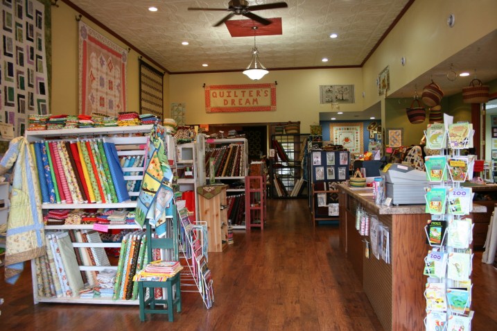 Quilter's Dream features a beautiful original tin ceiling and a wonderful collection of quilts, fabrics, notions and more.