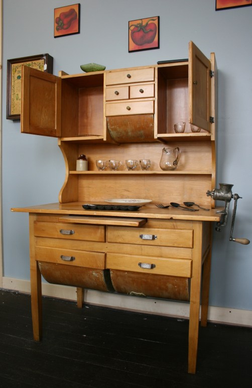 This 100-plus-year-old Hoosier cabinet had seven layers of paint on it before Mary Bowen refinished it. The cabinet is being sold in her son Dean Turnlund's store for $325.