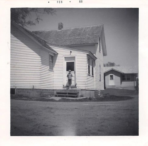 The old farmhouse to the left, where I grew up with the "new house," built in the late 1960s.