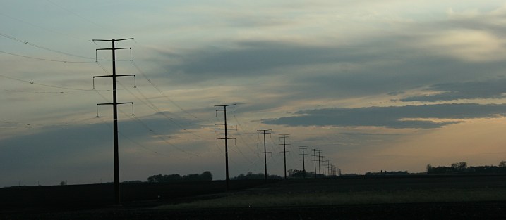 The sun sets across the prairie north of Winthrop on Friday.