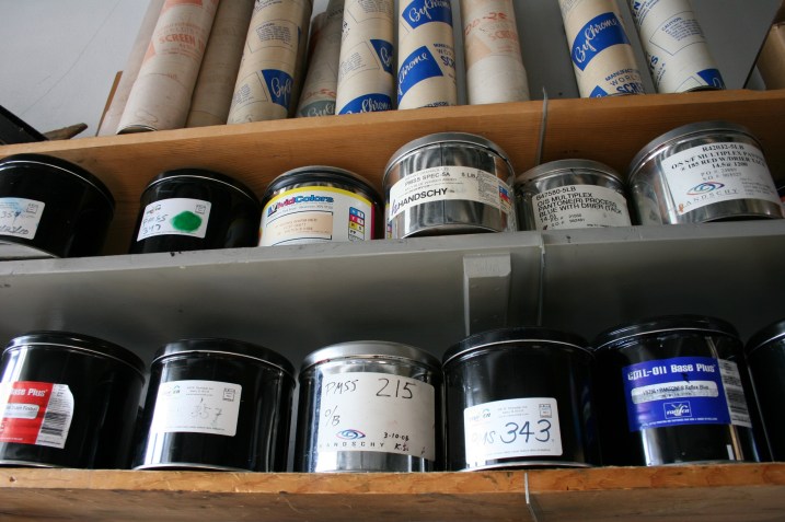 Cans of ink line shelves.
