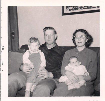 My parents with my brother and me in a photo dated January 1957, but likely taken a few months earlier.