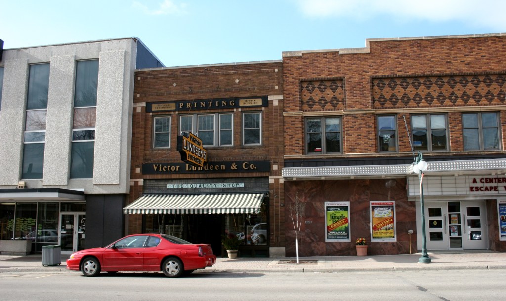 A street level view of Victor Lundeen Company, left, and the Fergus Theatre on the right.