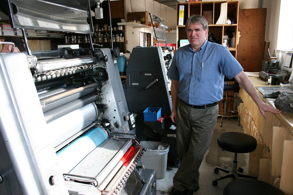 Tour guide Paul Lundeen inside his print shop.