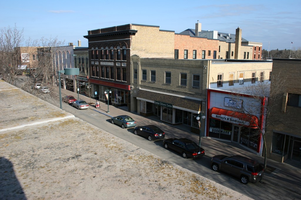 Positioned safely behind a high part in the theatre facade, forefront, I shot sections of the business district.