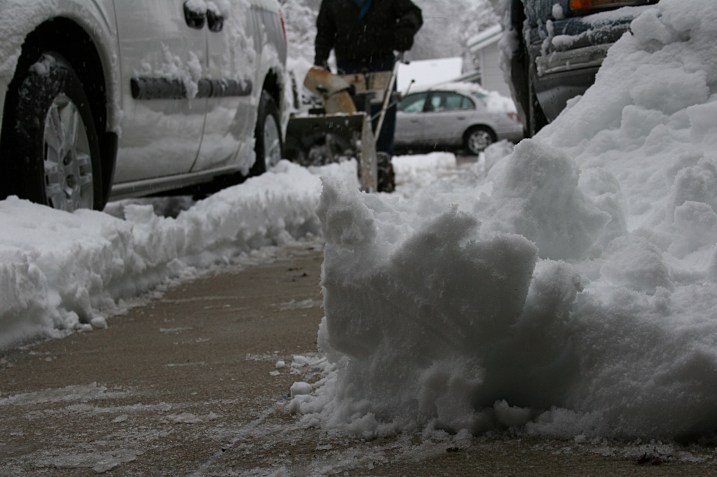 Clearing our snow-covered driveway.