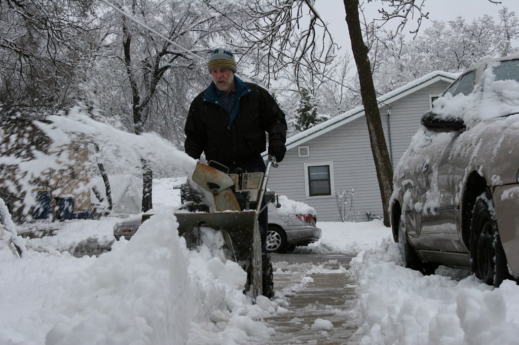My husband blowing out our driveway.