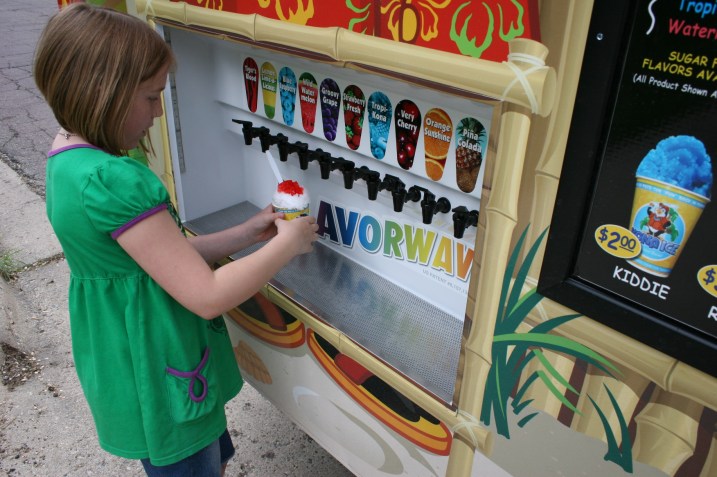 Todd advises customers to count to three to get just the right amount of flavoring on their shaved ices.