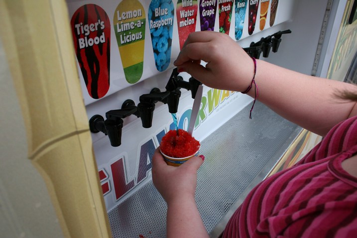Todd advises customers to count to three as they dispense flavor onto the ice, to get the right amount of flavoring.